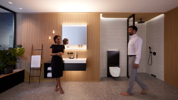 Uomo e donna in un bagno perfettamente illuminato con mobili da bagno e ceramiche Geberit ONE (© Geberit) Uomo e donna in un bagno perfettamente illuminato con mobili da bagno e ceramiche Geberit ONE (© Geberit)